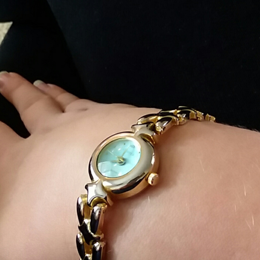 Castle gold watch with baby blue face